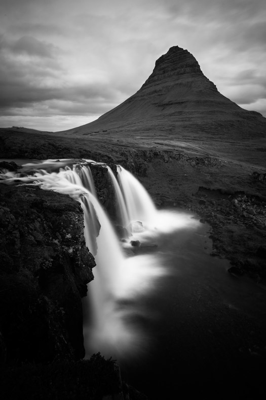 Kirkjufell Mountain and Kirkjufellfoss Waterfall in black-and-white long exposure
