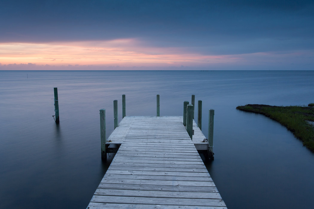 Sunset on a dock in the Pamlico Sound of the Outer Banks, North Carolina