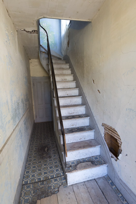 Decrepit staircase in abandoned house. Bannack, Montana