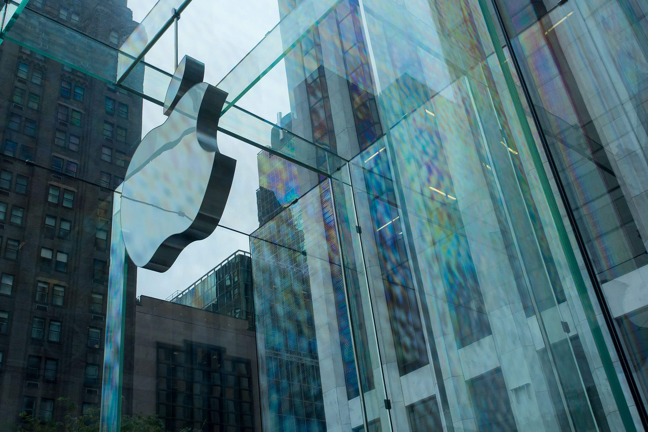 Apple logo on glass wall of 5th Avenue Apple Store