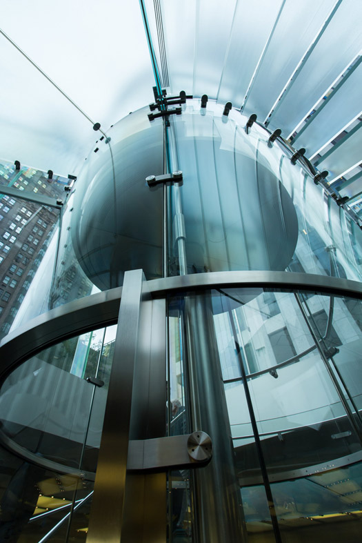 Cylinder-shaped glass elevator at Apple Store NYC