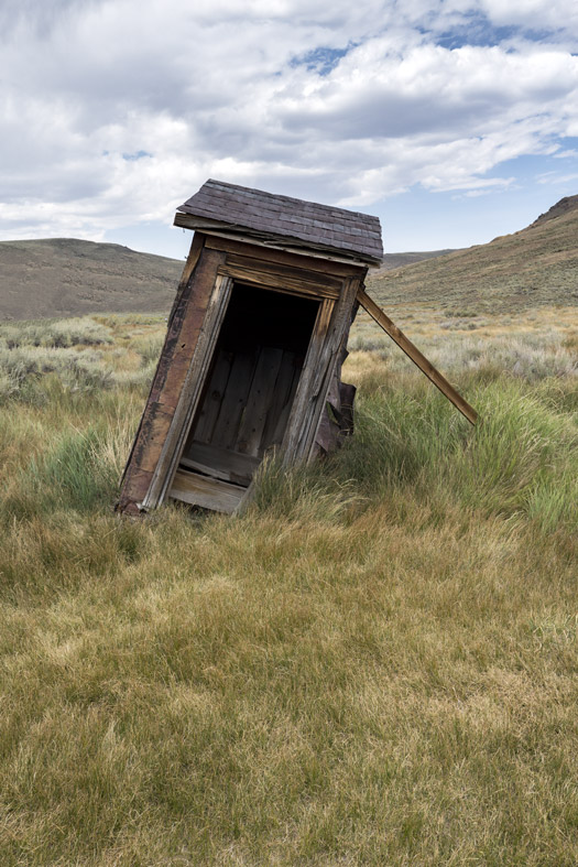 Leaning outhouse in Bodie, California ghost town
