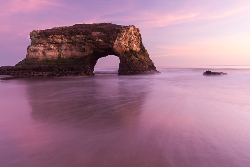Rock arch of Natural Bridges State Beach in Santa Cruz, California
